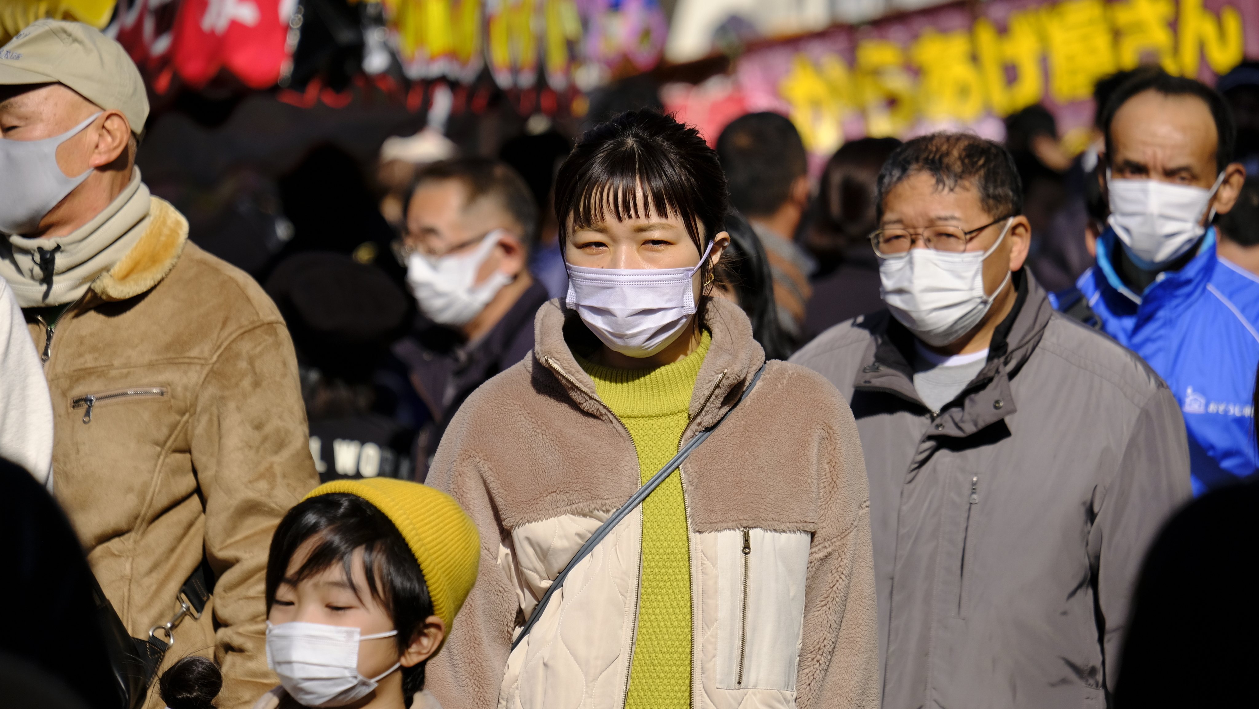 People wearing face masks as a preventive measure against