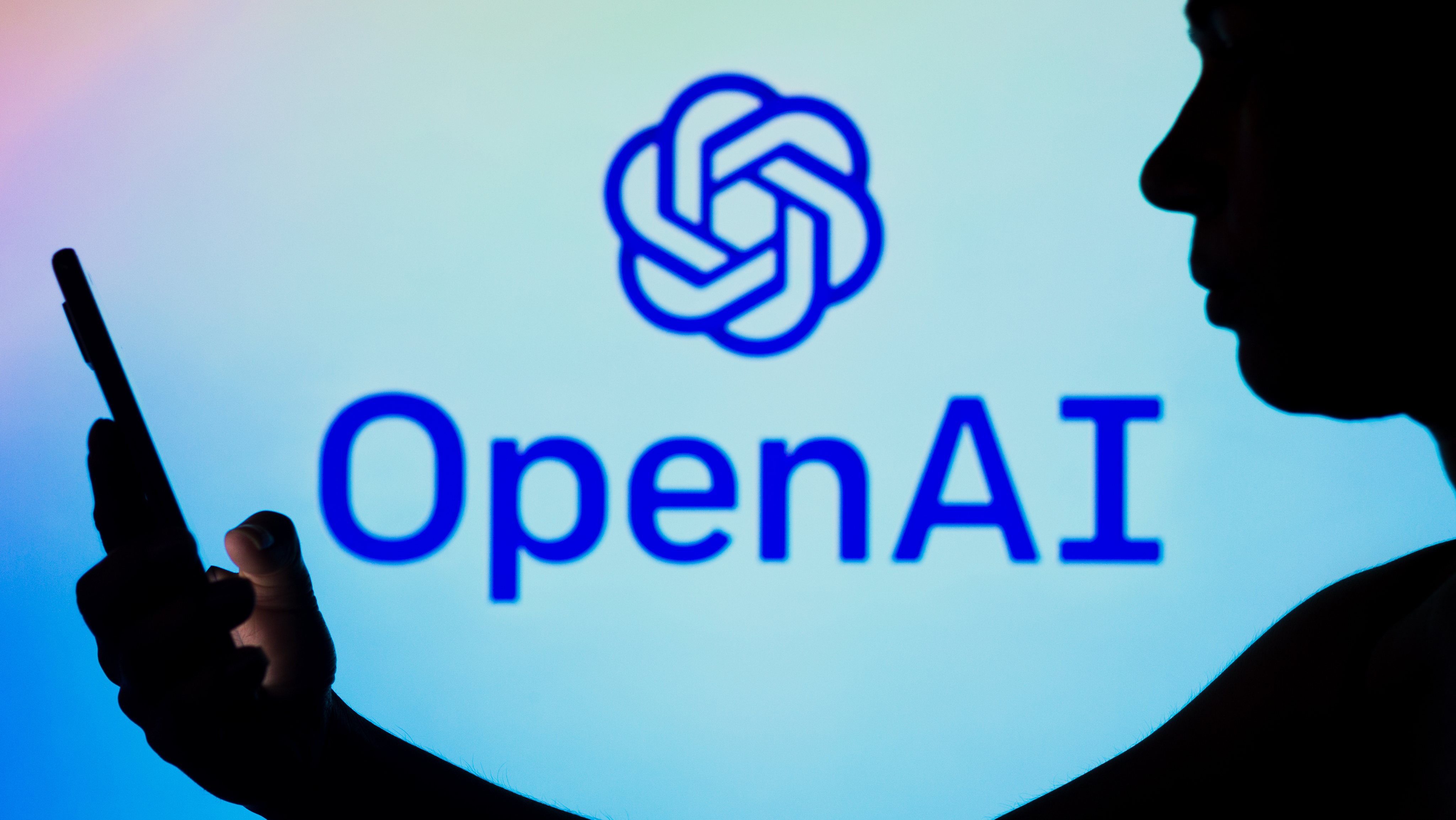 In this photo illustration, the OpenAI logo is seen in the