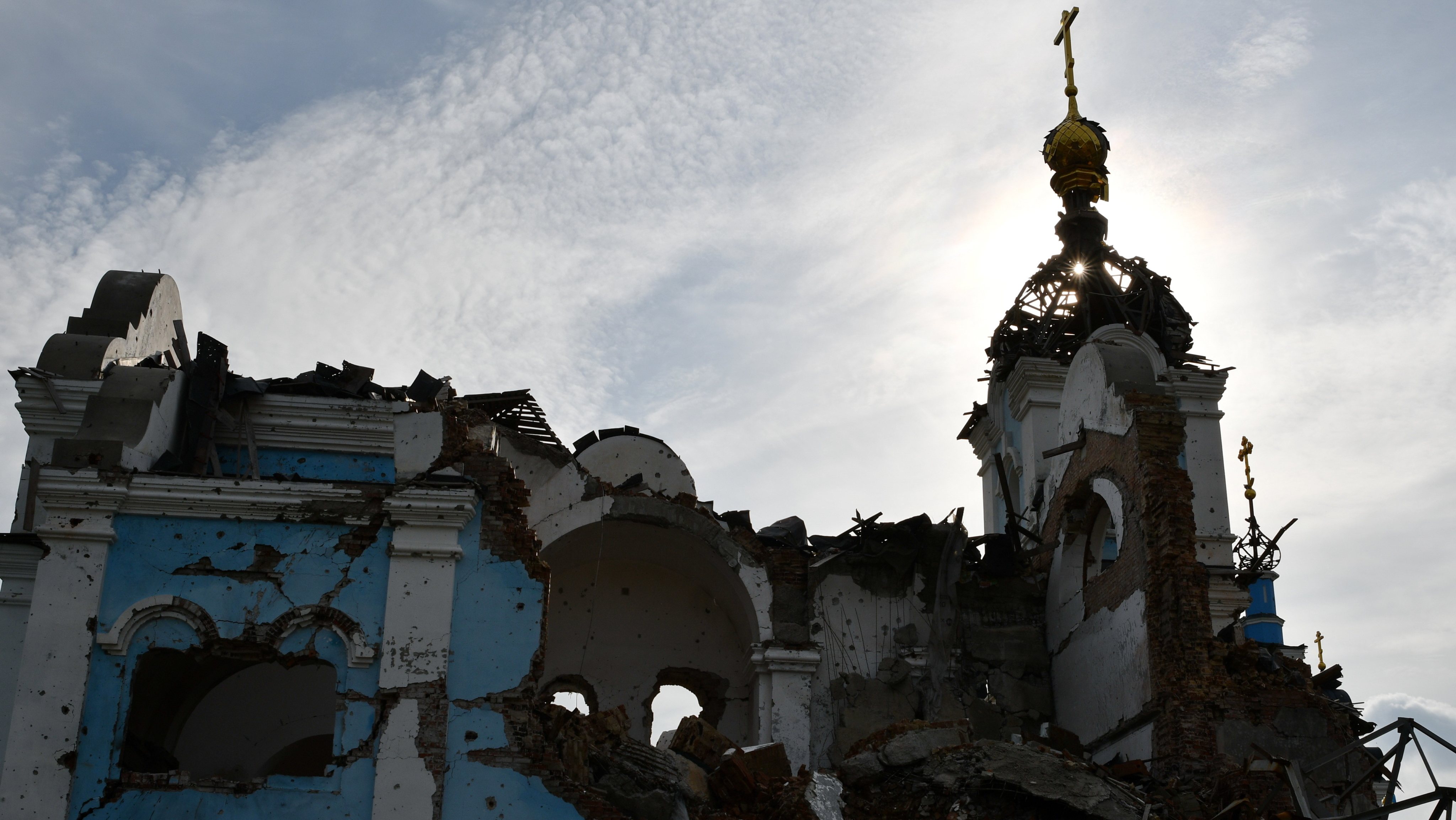A view of a heavily damaged church in the retaken village of