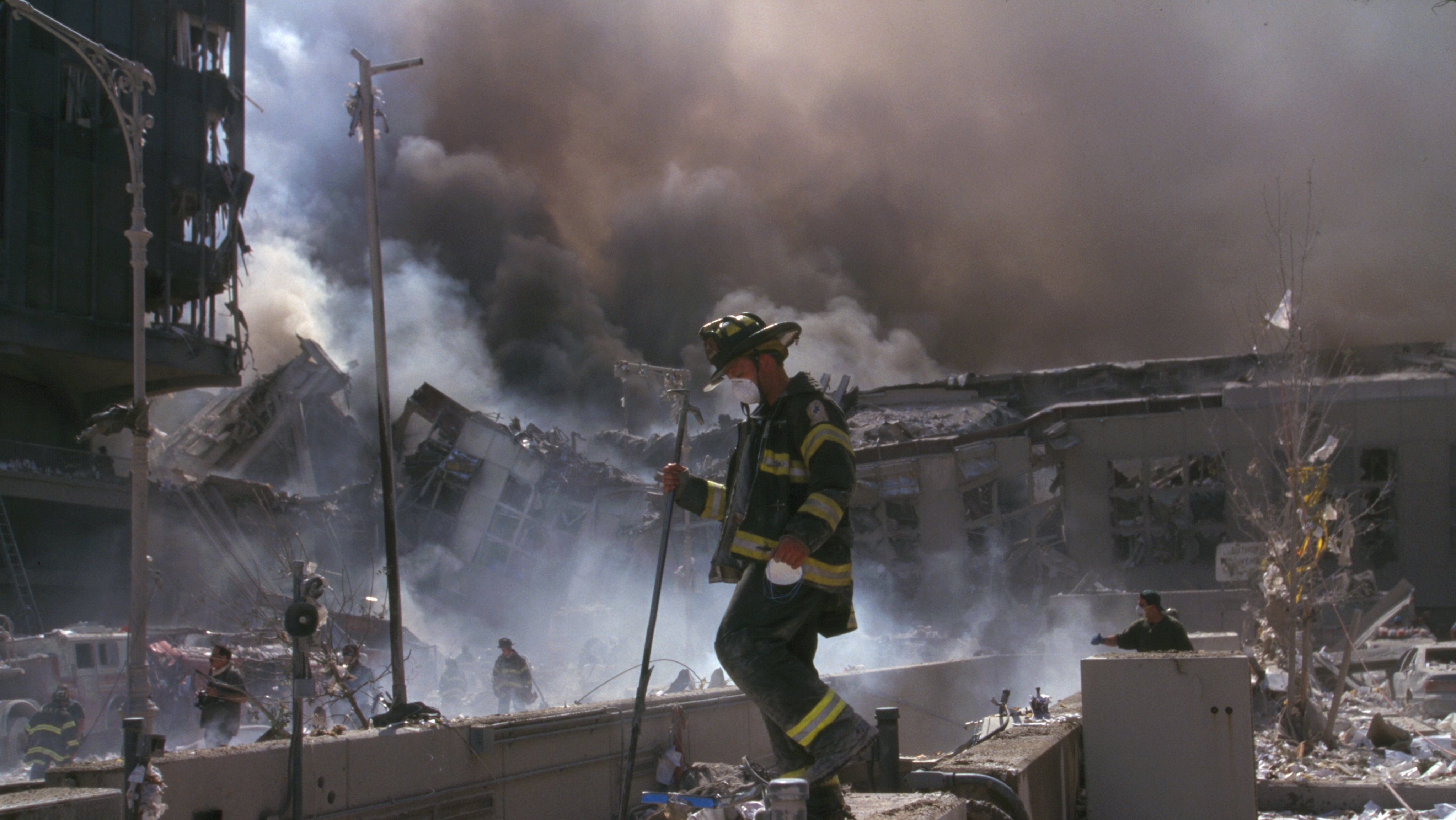 New York Firefighters amid the rubble of the World Trade Centre following the 9/11 attacks.