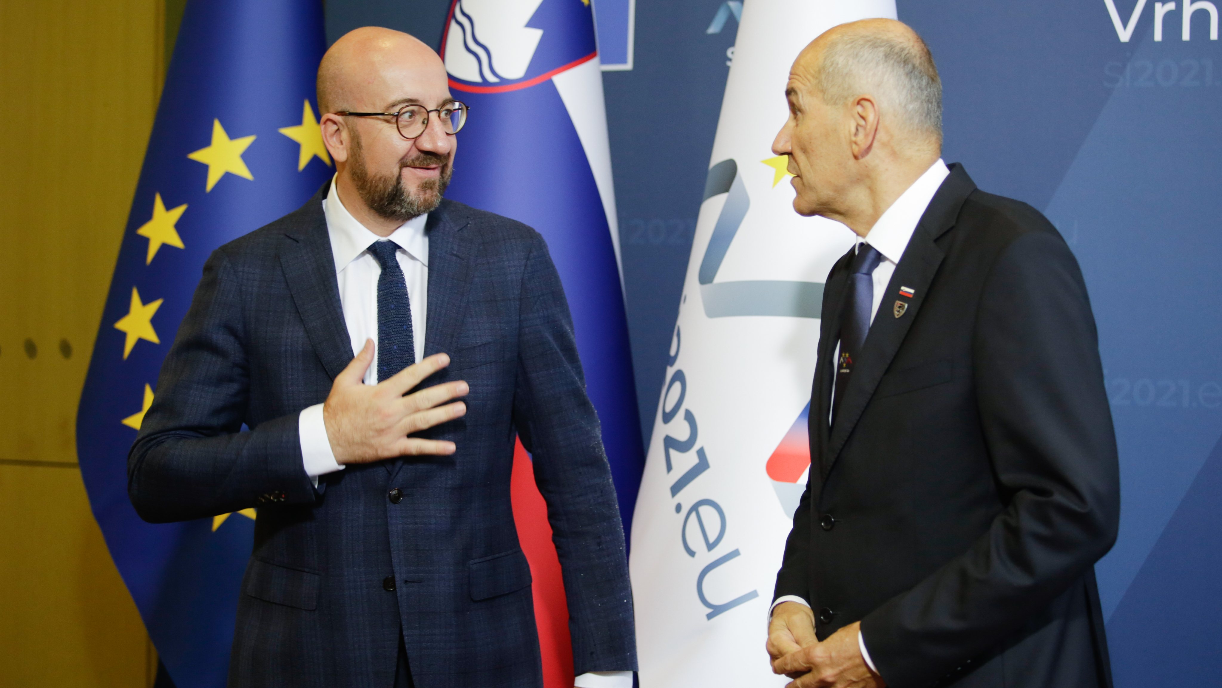 Slovenian Prime Minister Janez Jansa (R)  welcomes Charles