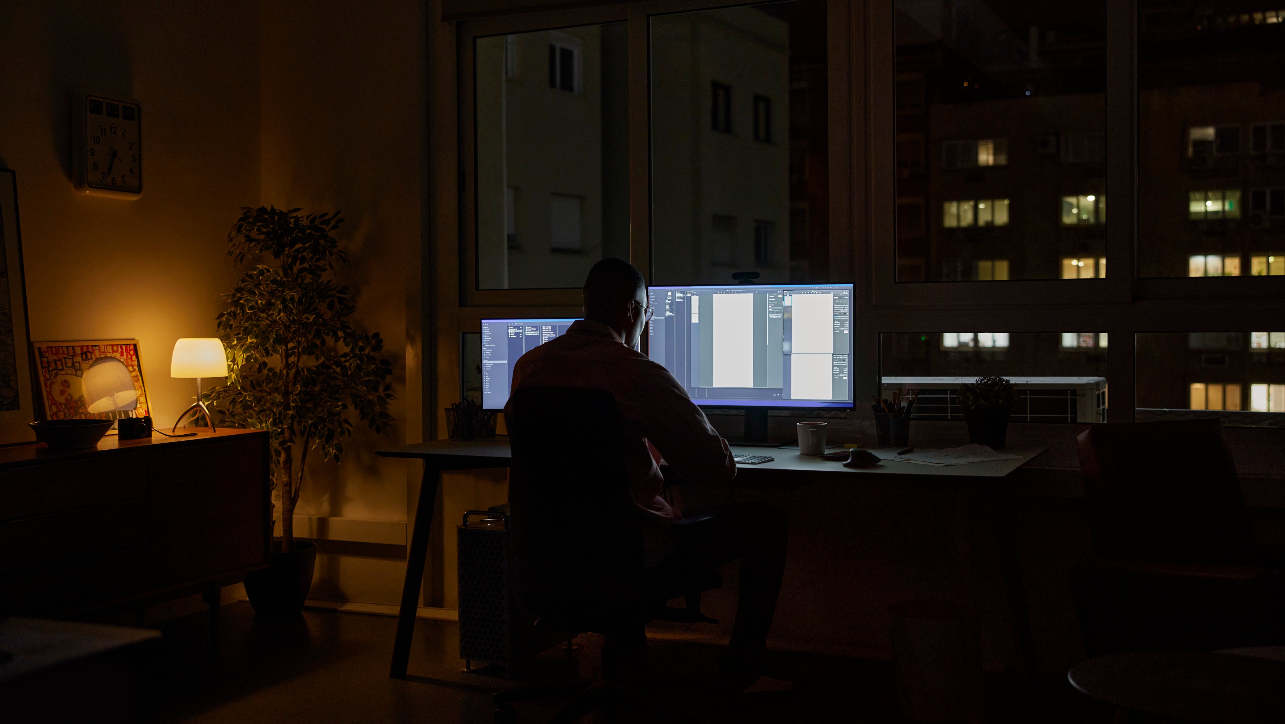 Businessman using computer late at night