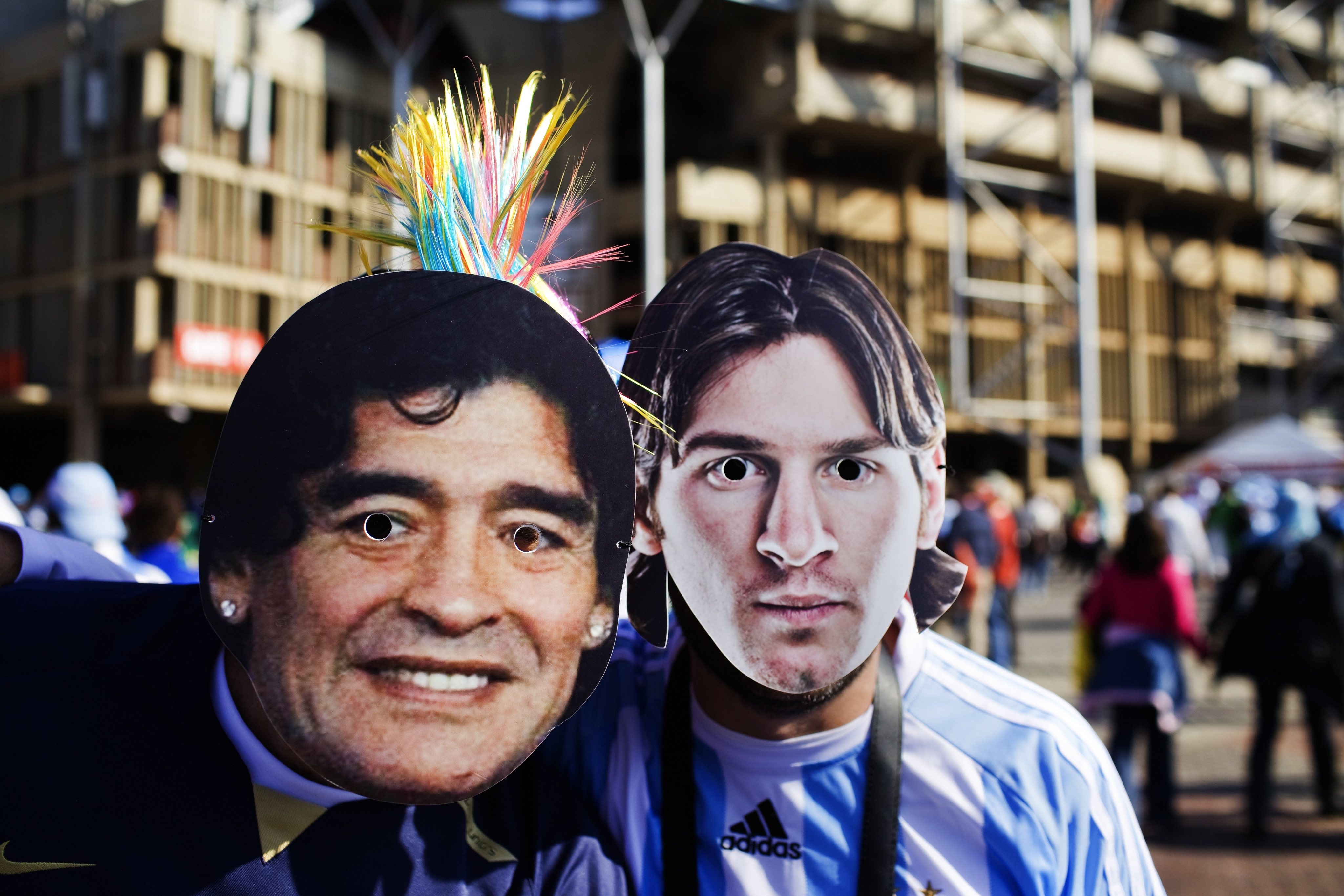 Football fans wearing masks of Argentina
