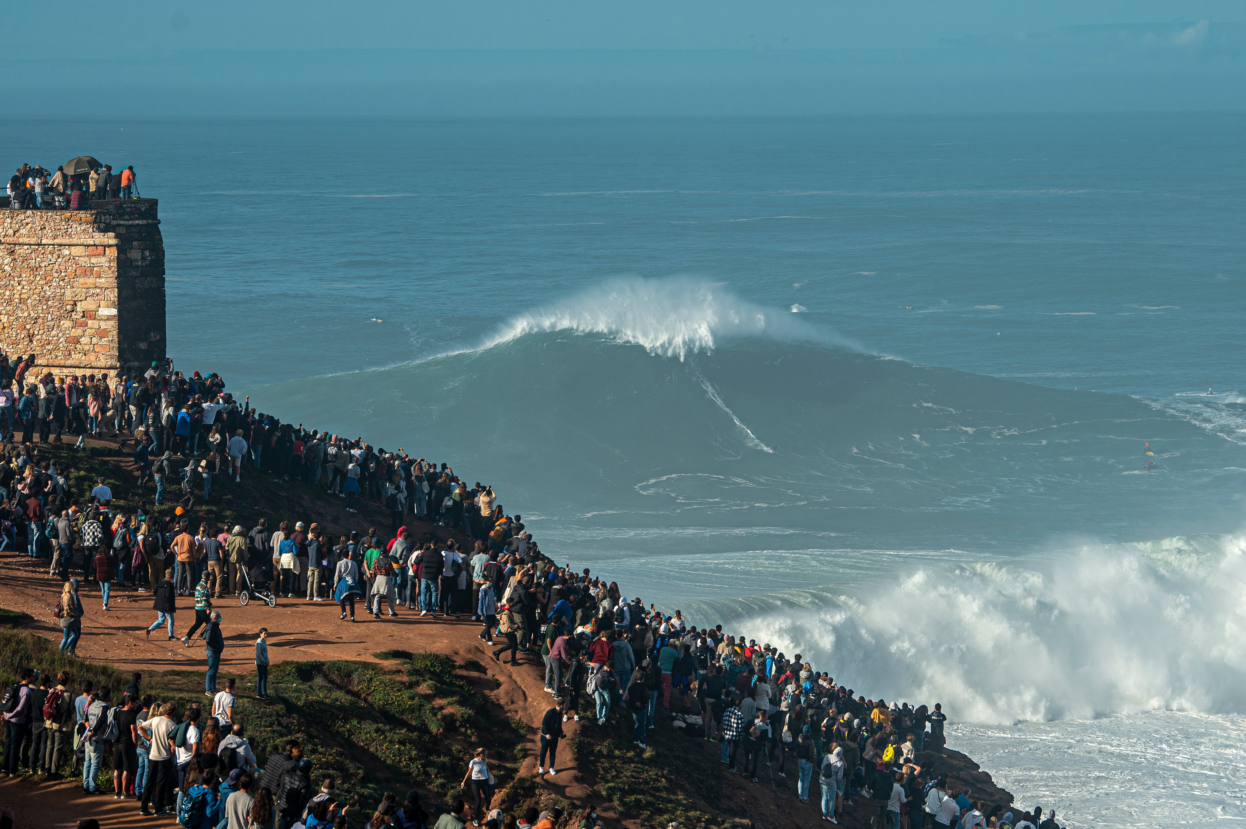 Surfers Ride The Nazare Big Waves