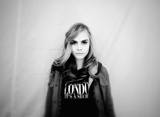 PARIS, FRANCE - FEBRUARY 27:  (Editors Note: This image was processed using digital filters) Model Cara Delevingne poses backstage before the H&M Fall/Winter 2013 Ready-to-Wear show as part of Paris Fashion Week on February 27, 2013 in Paris, France.  (Photo by Gareth Cattermole/Getty Images)