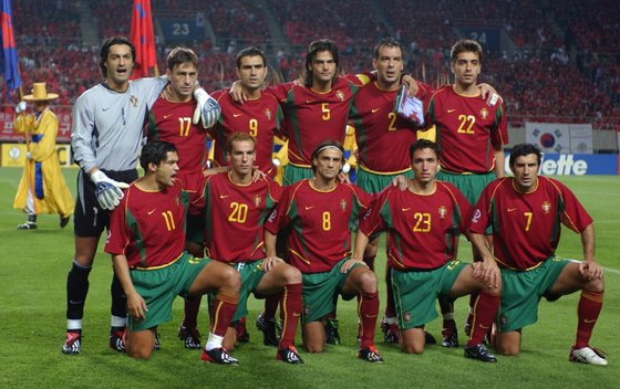 INCHEON, REPUBLIC OF KOREA:  Portugal line up for a team photo, 14 June 2002 at the Incheon Munhak Stadium in Incheon, prior to first round Group D action between Portugal and Korea in the 2002 FIFA World Cup Korea/Japan. From L above: Vitor Baia, Paulo Bento, Pauleta, Fernando Couto, Jorge Costa, Beto. From L bottom: Sergio Conceitao, Petit, Joao Pinto, Rui Jorge, Luis Figo. AFP PHOTO/EMMANUEL DUNAND (Photo credit should read EMMANUEL DUNAND/AFP/Getty Images)