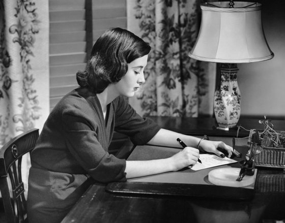 UNITED STATES - CIRCA 1950s:  Portrait of woman writing letter at desk.  (Photo by George Marks/Retrofile/Getty Images)