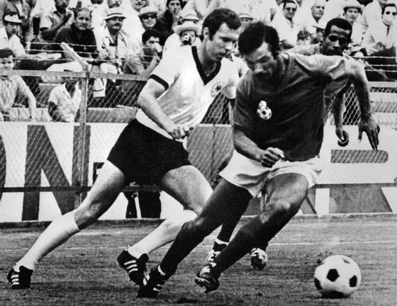 LEON, MEXICO - JUNE 3:  West German midfielder Franz Beckenbauer (L) fights for the ball with Moroccan Benkhrif Boujemaa as Mohammed El Filali (back) looks on  during the World Cup first round soccer match between West Germany and Morocco 03 June 1970 in Leon. West Germany won 2-1. AFP PHOTO  (Photo credit should read STAFF/AFP/Getty Images)