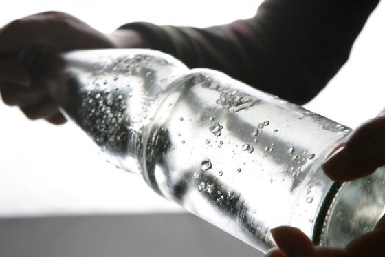 BERLIN - JANUARY 14: A bottle of carbonated mineral water is being shaken on January 14, 2007 in Berlin, Germany.  (Photo Illustration by Andreas Rentz/Getty Images)