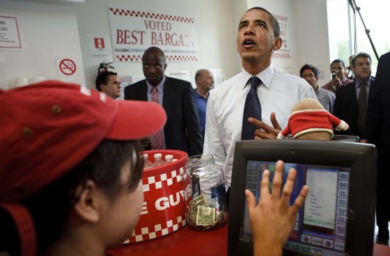 WASHINGTON - MAY 29:  US President Barack Obama at a Five Guys restaurant May 29, 2009 in Washington, DC.  President Obama traveled with his motorcade to the burger restaurant in Southeast Washington.  (Photo by Brendan Smialowski/Getty Images)