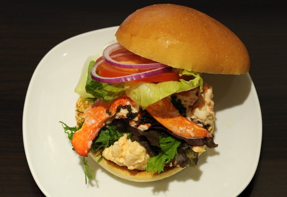 This picture shows the Lobster and Caviar burger featuring Canadian lobster and contains whole lobster pieces as well as a lobster salad made with a mustard mayonnaise as well as a sprinkle of caviar produced by Wendy's Japan as part of the campany's opening of their second restaurant in Roppongi, Tokyo on August 17, 2012. Wendy's Japan introduced two new burgers to their Japan Premium line of burgers which features fancy ingredients.      AFP PHOTO / KAZUHIRO NOGI        (Photo credit should read KAZUHIRO NOGI/AFP/GettyImages)