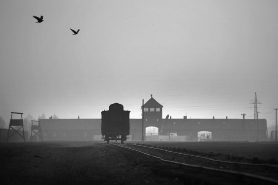 OSWIECIM, POLAND - NOVEMBER 13: The railway track leads to the infamous 'Death Gate' at the Auschwitz II Birkenau extermination camp on November 13, 2014 in Oswiecim, Poland. Ceremonies marking the 70th anniversary of the liberation of the camp by Soviet soldiers are due to take place on January 27, 2015. Auschwitz was a network of concentration camps built and operated in occupied Poland by Nazi Germany during the Second World War. Auschwitz I and nearby Auschwitz II-Birkenau was the extermination camp where an estimated 1.1 million people, mostly Jews from across Europe, were killed in gas chambers or from systematic starvation, forced labour, disease and medical experiments. (Photo by Christopher Furlong/Getty Images)