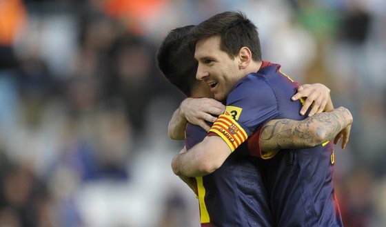 Barcelona's forward Cristian Tello (L) celebrates with his teammate Argentinian forward Lionel Messi after scoring during the Spanish league football match RC Celta de Vigo vs FC Barcelona at the Balaidos Stadium in Vigo on March 30, 2013.  AFP PHOTO / MIGUEL RIOPA        (Photo credit should read MIGUEL RIOPA/AFP/Getty Images)