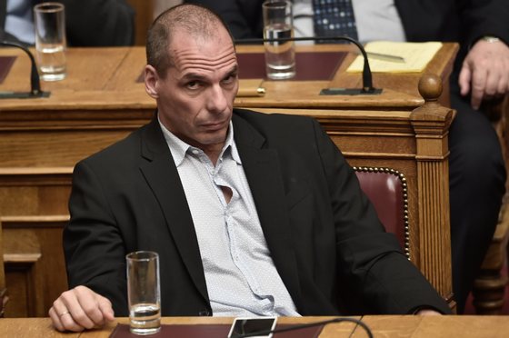 Greek Finance Minister Yanis Varoufakis attends a parliament session in Athens on March 30, 2015. The EU warned Monday that Greece and its creditors had yet to hammer out a new list of reforms despite talks lasting all weekend aimed at staving off bankruptcy and a euro exit. AFP PHOTO / ARIS MESSINIS        (Photo credit should read ARIS MESSINIS/AFP/Getty Images)