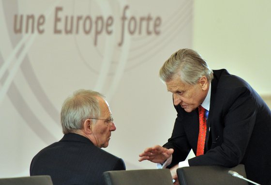 German Finance Minister Wolfgang Schaeuble (L) and European Central Bank President Jean-Claude Trichet talk on April 8, 2011 before the start of an informal meeting of EU finance ministers in Godollo, near the Hungarian capital Budapest, to thrash out the terms of a multi-billion dollar loan to Portugal after the debt-laden Lisbon government formally requested a bailout. The ministers were expected to discuss both the size of the loan and the terms of its repayment at the two-day meeting. Around two-thirds of the cash will come from the EU while the rest will be covered by the International Monetary Fund.  AFP PHOTO / GEORGES GOBET        (Photo credit should read GEORGES GOBET/AFP/Getty Images)