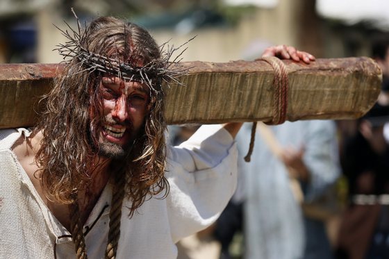 An actor performs the Passion of Christ during Good Friday, in Castro Urdiales, province of Cantabria in northern Spain on April 18, 2014. Living Passion is a representation of the Passion of Christ from the last supper to his crucifixion, death and resurrection.   AFP PHOTO/ CESAR MANSO        (Photo credit should read CESAR MANSO/AFP/Getty Images)