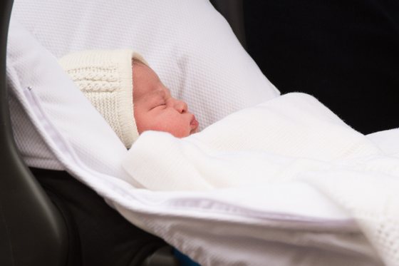 Britain's Prince William, Duke of Cambridge, carries his newly-born daughter, his second child with Catherine, Duchess of Cambridge, as they leave the Lindo Wing at St Mary's Hospital in central London, on May 2, 2015.  The Duchess of Cambridge was safely delivered of a daughter weighing 8lbs 3oz, Kensington Palace announced. The newly-born Princess of Cambridge is fourth in line to the British throne.   AFP PHOTO / LEON NEAL        (Photo credit should read LEON NEAL/AFP/Getty Images)
