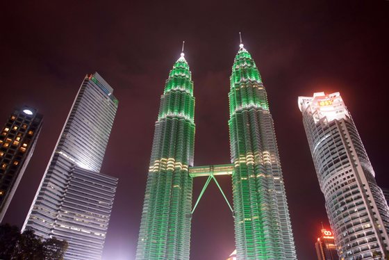 A general view shows the lights of the Petronas towers in Kuala Lumpur before being switched off for earth hour on March 29, 2014. Lights went off in thousands of cities and towns across the world on for the annual Earth Hour campaign, which is aiming to raise money via the Internet for local environmental projects. AFP PHOTO / Ed Jones        (Photo credit should read ED JONES/AFP/Getty Images)