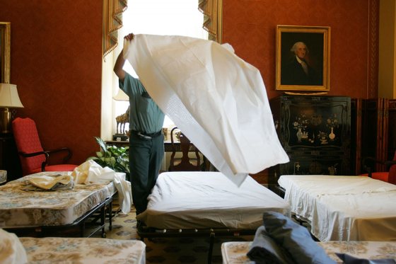 WASHINGTON - MAY 23:  Carlos Abarca puts sheets on a cot in the Strom Thurmond Room for Republican senators who are prepared to spend all night discussing judicial nominees and the use of a filibuster with Democrats May 23, 2005 at the U.S. Capitol in Washington, DC.  (Photo by Joe Raedle/Getty Images)