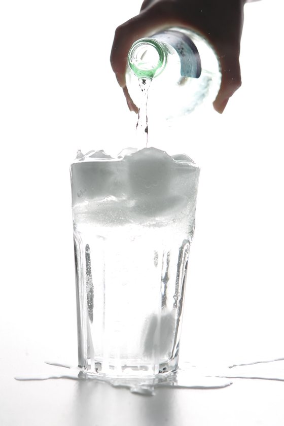 BERLIN - JANUARY 14: Water pours into a glass with ice cubes on January 14, 2007 in Berlin, Germany.  (Photo Illustration by Andreas Rentz/Getty Images)