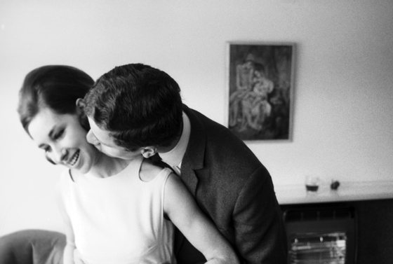 A young couple kissing in a London room, May 1964. (Photo by Bert Hardy Advertising Archive/Getty Images)