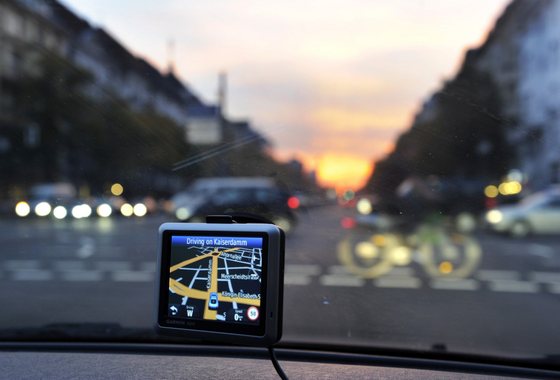 Directions are shown on a GPS unit mounted in a car travelling along Kaiserdamm at dusk in Berlin, October 8, 2010. AFP PHOTO / ODD ANDERSEN (Photo credit should read ODD ANDERSEN/AFP/Getty Images)