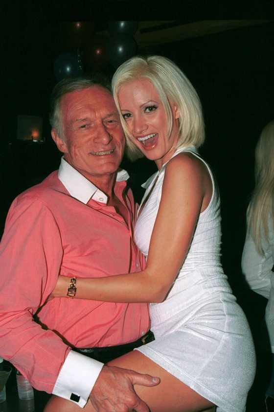 BEVERLY HILLS, CA - SEPTEMBER 25: Hugh Hefner and girlfriend playboy model Holly Madison hug during a birthday party for Hef's two other girlfriends Izabella Kasprzyk and Bridget Marquardt at Joya restaurant on September 25, 2002 in Beverly Hills, California. (Photo by David Klein/Getty Images)