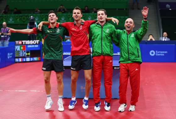 BAKU, AZERBAIJAN - JUNE 15:  Joao Geraldo, Tiago Apolonia, Marcos Freitas and coach of Portugal celebrate winning the gold medal in the Mens Table Tennis Team Final during day three of the Baku 2015 European Games at Baku Sports Hall on June 15, 2015 in Baku, Azerbaijan.  (Photo by Francois Nel/Getty Images for BEGOC)