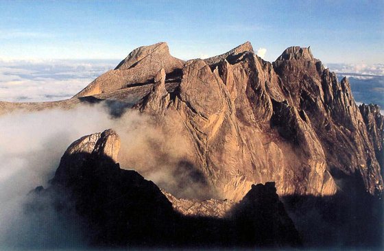 KOTA KINABALU, MALAYSIA:  This undated photo shows Mount Kinabalu, South East Asia's highest peak, in East Malaysia's state of Sabah. A Malaysian rescue team has found signs that 17-year-old British girl Ellie James who got lost on Mount Kinabalu for six days may still be alive.  Ellie, on holiday from Cornwall, England became separated from her family August 16 2001 while descending the 4,101 metre (13,454 feet) Mount Kinabalu in bad weather. She wandered off with her 15-year-old brother Henry, but he was found six hours later by rescuers. A special 20-man disaster relief team from Kuala Lumpur arrived 21 August 2001 and joined some 70 rescuers, including police, troops and volunteers, to comb the foggy jungle as they continue their search.    AFP PHOTO (Photo credit should read AFP/Getty Images)