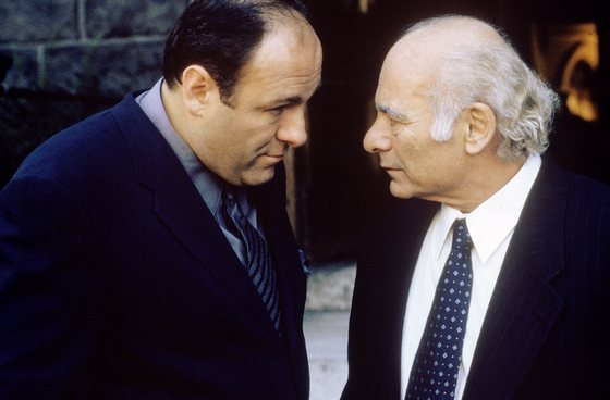 387931 09: James Gandolfini as Tony Soprano and Burt Young as Bobby "Bacala" Baccalieri, Sr. act in a scene in HBO's hit television series, "The Sopranos" (Year 3). (Photo by HBO)