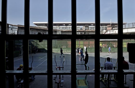 View of the yard of the penitentiary of Santiago, Chile on August 13, 2014. Wearing three-piece suits and carrying bibles, a group of evangelists are reforming Chilean prisons. They claim their visits to prisoners have resulted in many conversions to evangelism and that the recidivism has decreased. AFP PHOTO/MARTIN BERNETTI        (Photo credit should read MARTIN BERNETTI/AFP/Getty Images)