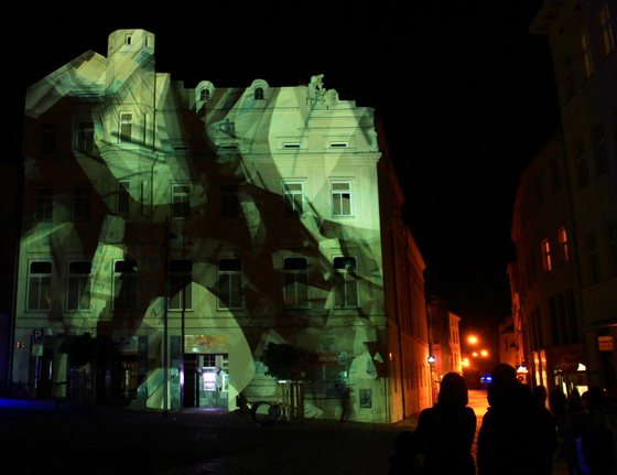 An image is displayed at the facade of a house during the Festival of Light and Videomapping in Olomouc, Czech Republic on September 28, 2013. AFP PHOTO / RADEK MICA        (Photo credit should read RADEK MICA/AFP/Getty Images)