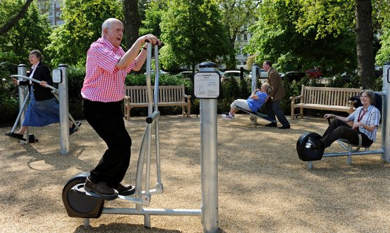 Winston Fletcher (2nd L) uses an exercise machine alongside other elderly participants during the official opening of the first pensioners' playground in Hyde Park in London on May 19, 2010. The outdoor facility features fun fitness equipment that offers a range of exercises to improve strength and flexibility and help adults continue active and healthy lifestyles in later years. Play areas for older people are popular in China and parts of Europe, but this is the first of its kind in London. AFP PHOTO / Adrian Dennis (Photo credit should read ADRIAN DENNIS/AFP/Getty Images)