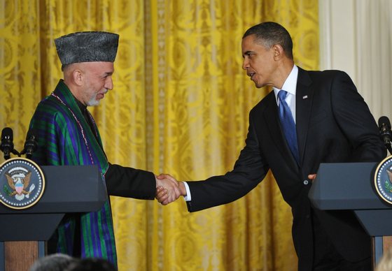 Afghan President Hamid Karzai shakes hands with US President Barack Obama during a press conference May 12, 2010 in the East Room of the White House in Washington, DC. Obama praised Wednesday the "broad and deepening" US partnership with Afghanistan and said he and visiting Afghan counterpart Hamid Karzai had renewed their goal to defeat Al-Qaeda. AFP PHOTO/Mandel NGAN (Photo credit should read MANDEL NGAN/AFP/Getty Images)