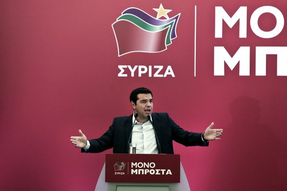 Alexis Tsipras, leader of the radical leftist party Syriza, gives a speech at the Syriza party's central committee in Athens, on August 29, 2015. Greece geared up for a snap election next month, with an opinion poll showing the leftist party Syriza ahead despite a wave of defections over the country's massive new bailout. AFP PHOTO / ANGELOS TZORTZINIS (Photo credit should read ANGELOS TZORTZINIS/AFP/Getty Images)