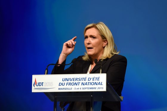 French far-right Front National party's president Marine Le Pen delivers a speach during the summer far-right National Front (FN) congress in Marseille on September 6, 2015. AFP PHOTO / ANNE-CHRISTINE POUJOULAT (Photo credit should read ANNE-CHRISTINE POUJOULAT/AFP/Getty Images)