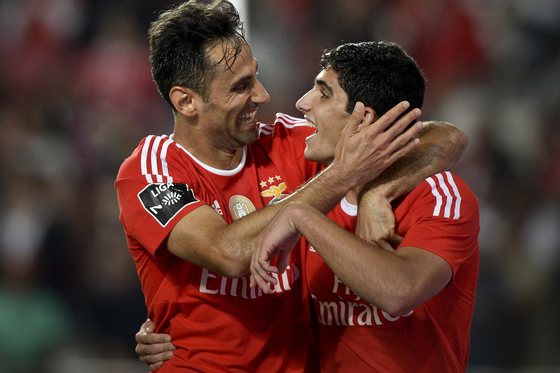 Benfica's Brazilian forward Jonas Oliveira (L) celebrates with his teammate Benfica's forward Goncalo Guedes (R) after scoring during the Portuguese league football match SL Benfica vs FC Pacos de Ferreira at the Luz stadium in Lisbon on September 26, 2015. AFP PHOTO / PATRICIA MELO MOREIRA (Photo credit should read PATRICIA DE MELO MOREIRA/AFP/Getty Images)