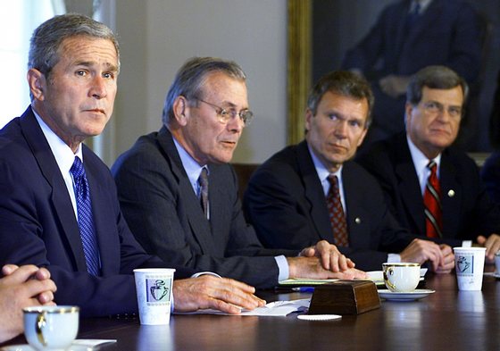WASHINGTON, UNITED STATES: (L-R) US President George W. Bush, looks on as US Secretary of Defense Donald Rumsfeld, Senate Majority Leader Tom Daschle, and Senate Minority Leader Trent Lott, attend a Congressional Leadership Meeting 12 September, 2001, in the Cabinet Room of the White House in Washington, DC. The leaders were to discuss plans in the wake of the largest terrorist attack in US history killing thousands of civilians in New York and Washington. AFP Photo Paul J. Richards (Photo credit should read PAUL J. RICHARDS/AFP/Getty Images)