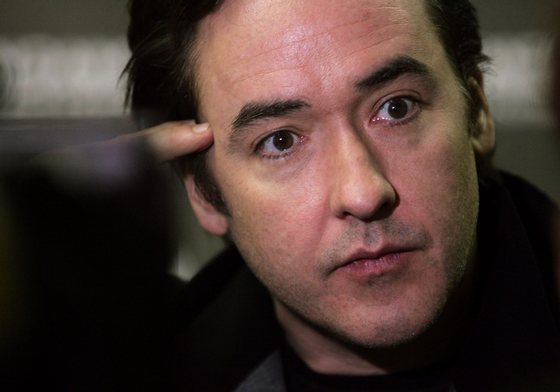 PARK CITY, UT - JANUARY 20: Actros John Cusack talks to the media during arrivals at the "Grace Is Gone" premiere held at the Racquet Club during the 2007 Sundance Film Festival on January 20, 2007 in Park City, Utah. (Photo by Peter Kramer/Getty Images)