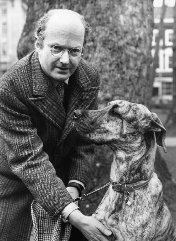 Auberon Waugh (1939 - 2001) the English journalist and novelist and eldest son of the author Evelyn Waugh, with his 'campaign manager', an Irish wolfhound, in London. (Photo by Hulton Archive/Getty Images)