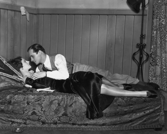 31st January 1931: Madeleine Carroll (1906 - 1987) and Robert Douglas play a love scene from the John Van Druten play 'After All' at the Criterion Theatre, London. (Photo by Sasha/Getty Images)