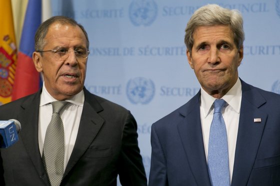 United States Secretary of State John Kerry (R) and Russia Foreign Minister Sergey Lavrov speak to the media after a meeting concerning Syria at the United Nations headquarters in New York on September 30, 2015. Russia's air strikes in Syria targeted opposition forces and not Islamic State jihadists, a US defense official said, contradicting Russian claims. At the United Nations in New York, Secretary of State John Kerry made clear that Washington would have "grave concerns" should Moscow opt to strike targets in areas where IS fighters and Al-Qaeda-linked groups are not operating. AFP PHOTO/Dominick Reuter (Photo credit should read DOMINICK REUTER/AFP/Getty Images)