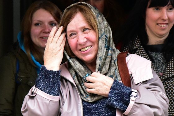 Belarus writer and journalist Svetlana Alexievich leaves after giving a press conference in Minsk, on October 8, 2015, following the announcement of her Nobel Literature Prize earlier in the day. Belarussian writer Svetlana Alexievich said on October 8 she was dedicating her Nobel prize for literature to her homeland -- where her books cannot be published -- blasting strongman rule there and in neighbouring Russia. AFP PHOTO / MAXIM MALINOVSKY (Photo credit should read MAXIM MALINOVSKY/AFP/Getty Images)