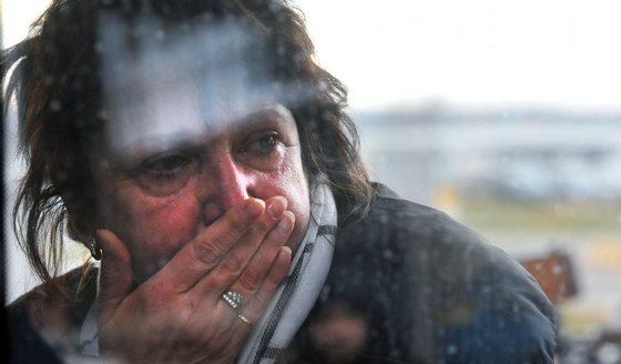 A relative reacts at Pulkovo international airport outside Saint Petersburg after a Russian plane with 224 people on board crashed in a mountainous part of Egypt's Sinai Peninsula on October 31, 2015. Ambulances reached the site and began evacuating "casualties," officials and state media reported, without elaborating on their condition. The plane took off early in the morning from the southern Sinai resort of Sharm el-Sheikh bound for Saint Petersburg in Russia but communication was lost 23 minutes after departure, officials said. AFP PHOTO / OLGA MALTSEVA        (Photo credit should read OLGA MALTSEVA/AFP/Getty Images)