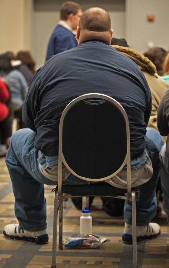 A potential contestant sits in a waiting room with over 500 people auditioning for the popular TV show, "The Biggest Loser", March 6, 2010, inside the Washington Convention Center, in Washington, DC.  "The Biggest Loser", where contestants compete to lose weight has become a worldwide hit, airing in over 90 countries and produced in 25 countries. Since its debut in 2004, "The Biggest Loser" has grown to become a standalone health and lifestyle brand with tools and products inspired by the show and approved by its doctors and experts.    AFP Photo/Paul J. Richards (Photo credit should read PAUL J. RICHARDS/AFP/Getty Images)