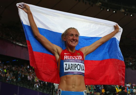 LONDON, ENGLAND - AUGUST 06: Yuliya Zaripova of Russia celebrates after winning the gold medal in the Women's 3000m Steeplechase final on Day 10 of the London 2012 Olympic Games at the Olympic Stadium on August 6, 2012 in London, England. (Photo by Alexander Hassenstein/Getty Images)