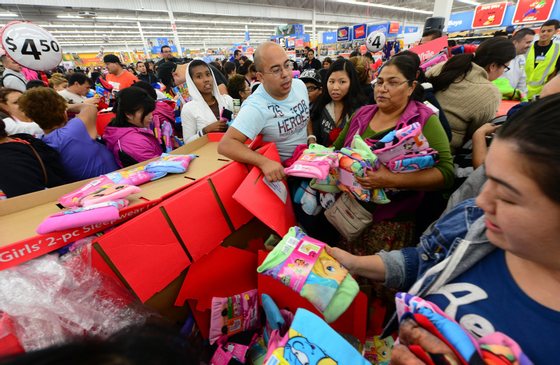 People get an early start on Black Friday shopping deals at a Walmart Superstore on November 22, 2012 in Rosemead, California, as many retailers stayed opened during the Thanksgiving celebrations, evidence that even this cherished American family holiday is falling prey to the forces of commerce. AFP PHOTO / Frederic J. BROWN (Photo credit should read FREDERIC J. BROWN/AFP/Getty Images)