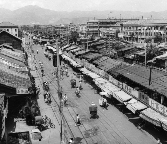 Circa 1955: Shops on Chung Hwa Road, Taipei, Taiwan (Formosa), built mostly after 1949 by Chinese refugees from the mainland. The more solid buildings on the right were built by the Japanese during their occupation of the island (from 1895 to 1945). (Photo by Three Lions/Getty Images)