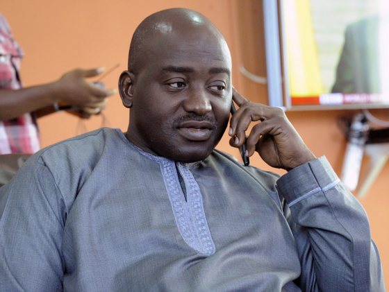 Liberia FA chairman Musa Bility speaks on his mobile phone on June 19, 2015, after annoucing plans to stand for the presidency of Fifa, in the Liberian capital Monrovia. AFP PHOTO / ZOOM DOSSO (Photo credit should read ZOOM DOSSO/AFP/Getty Images)