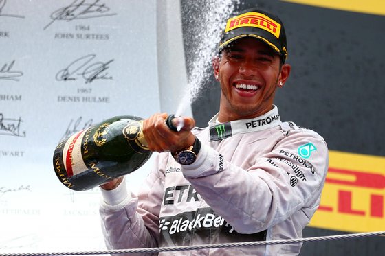 MONTMELO, SPAIN - MAY 11: Race winner Lewis Hamilton of Great Britain and Mercedes GP sprays champagne as he celebrates on the podium during the Spanish Formula One Grand Prix at Circuit de Catalunya on May 11, 2014 in Montmelo, Spain. (Photo by Dan Istitene/Getty Images)